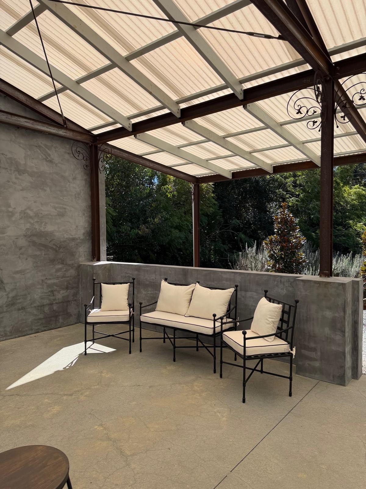 French black lounge on covered patio