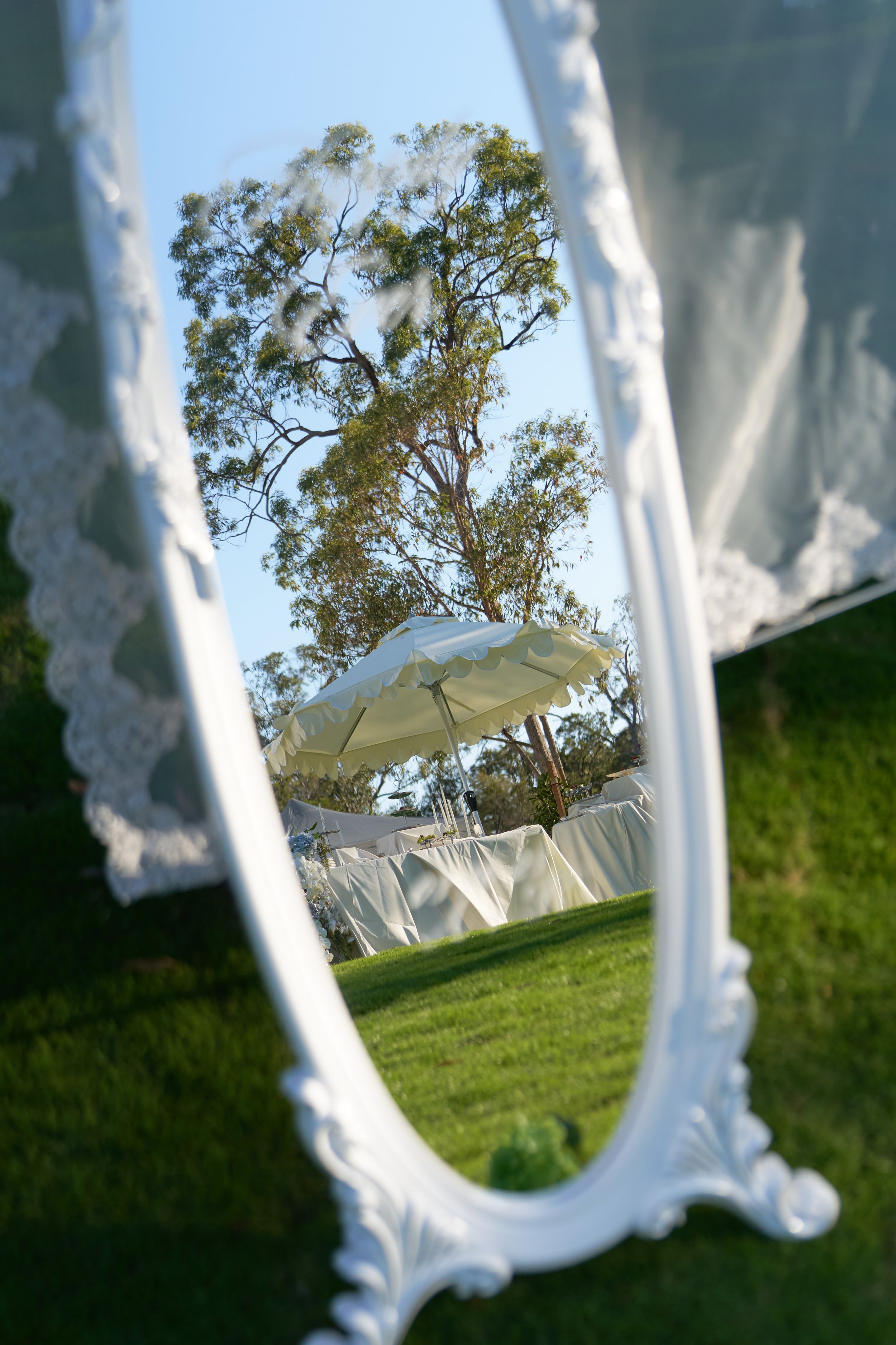 French Wave umbrella reflected at a wedding reception
